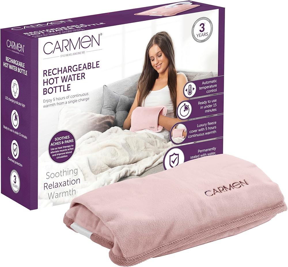 Carmen rechargeable hot water bottle, pink fleece cover with the Carmen brand embroidered, shown beside its packaging.